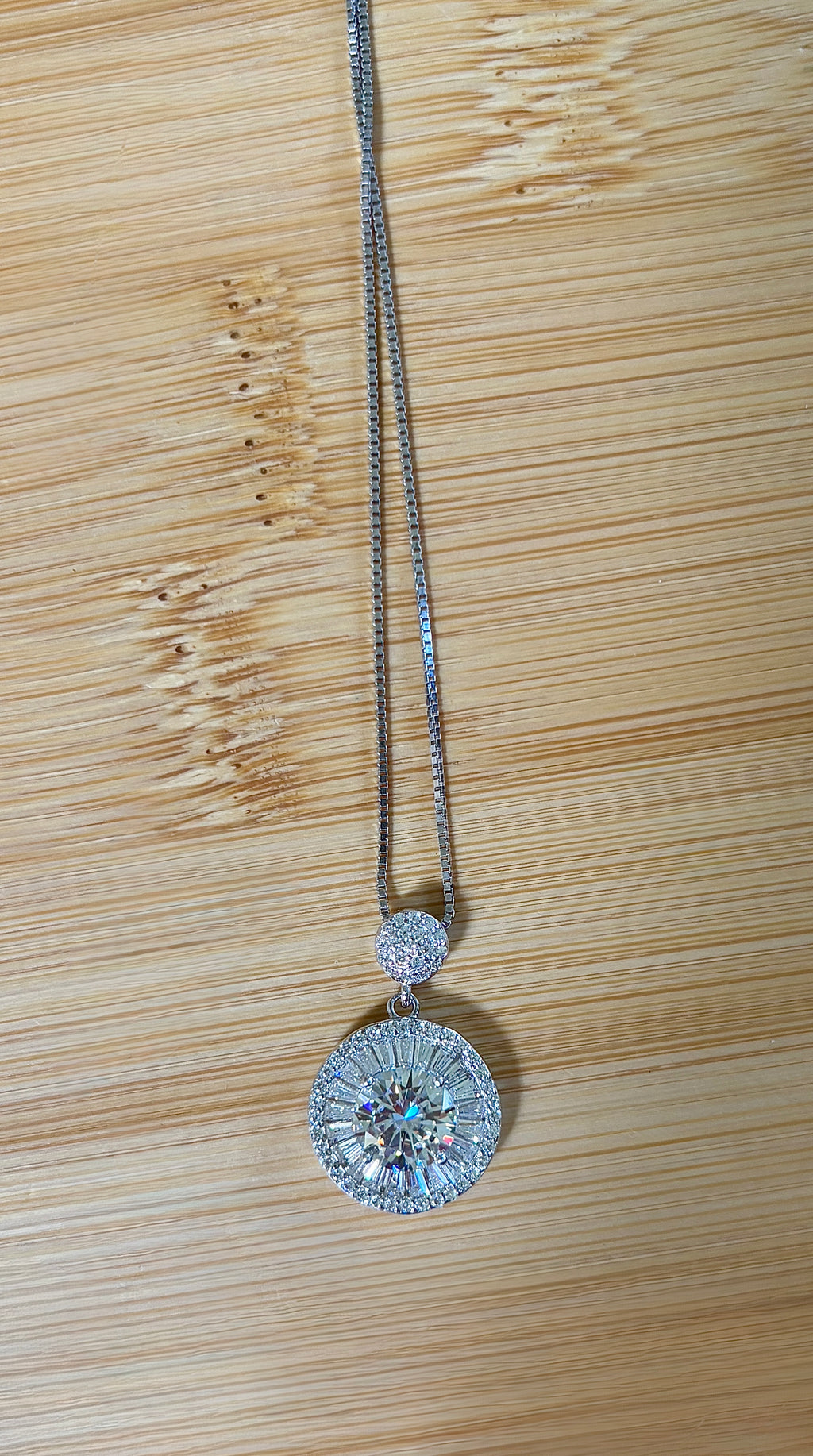 Moissanite necklace. The certified 2ct Moissanite “Sunburst” necklace with a 61 gemstone pendant plus more in the bail! Radiantly beautiful!