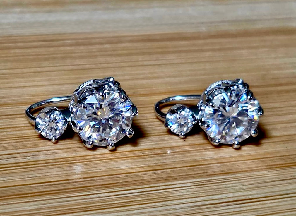 A Victorian inspired 4.2cttw certified pair of Moissanite 2-stone buckle back earrings in Argentium silver! Minimalist glam!