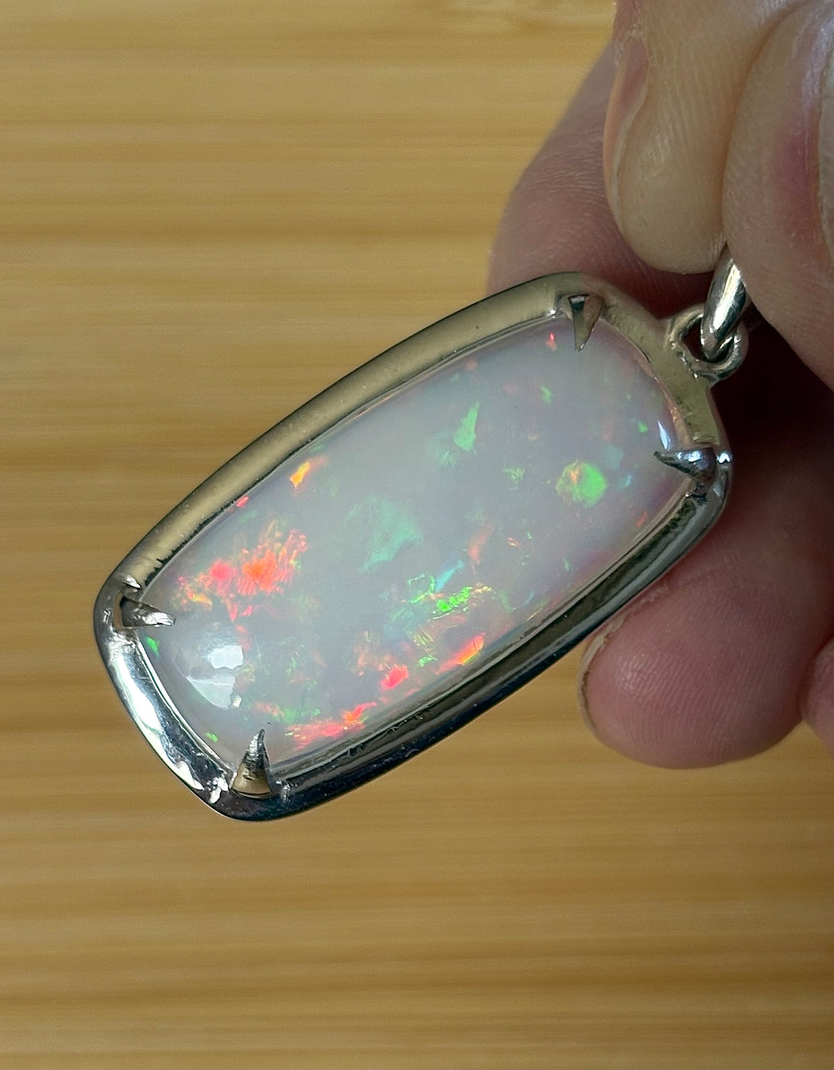 A 21ct AAA grade Ethiopian opal pendant, a handpicked opal and exclusive HKJ design! This lovely opal has gorgeous fire and play of color!