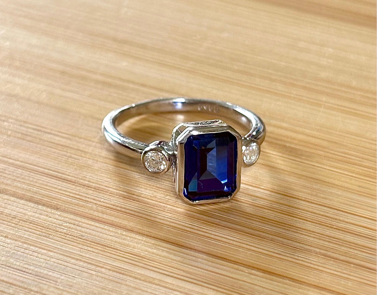 Blue sapphire and Moissanite ring. A certified 3ct lab-grown emerald-cut sapphire and .20ctw Moissanite ring in 925 sterling OR 935 Argentium!