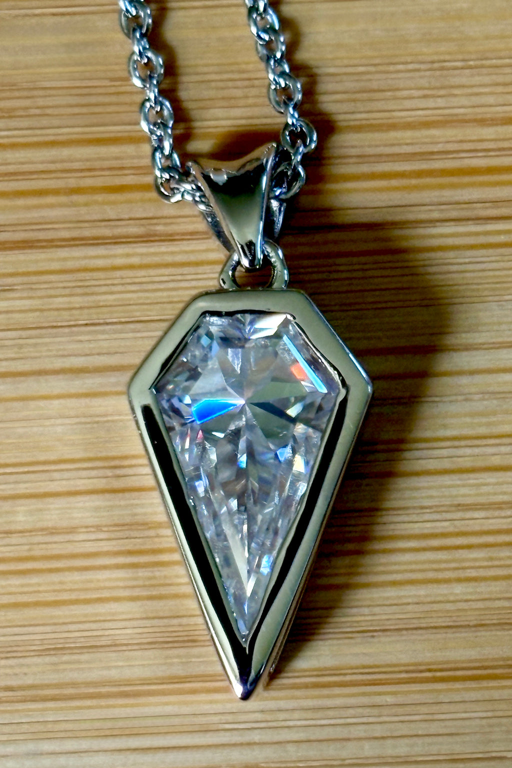 Moissanite necklace. “Flight!”, a kite-shaped, custom-cut 5ct Moissanite pendant! Hand-faceted by a master stone cutter and set in Argentium silver, it is suspended on a 20” sterling silver chain and is exclusive to Hand Knotted Jewelry!