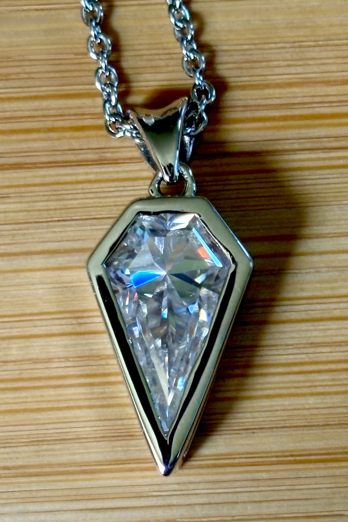 Moissanite necklace. “Flight!”, a kite-shaped, custom-cut 5ct Moissanite pendant! Hand-faceted by a master stone cutter and set in Argentium silver, it is suspended on a 20” sterling silver chain and is exclusive to Hand Knotted Jewelry!