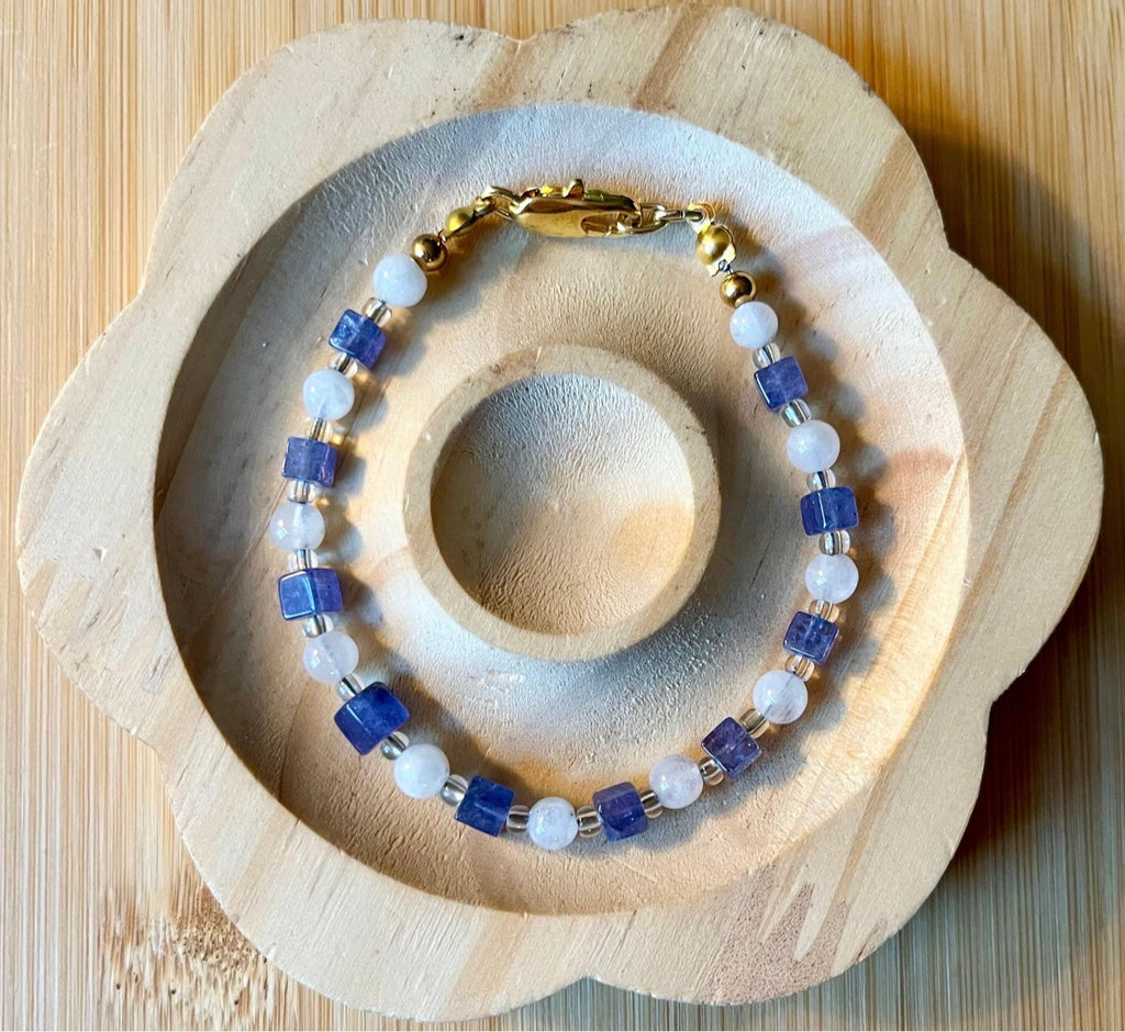 Moonstone and tanzanite bracelet. Dusky tanzanite cubes and round moonstones on stainless steel jeweler’s wire! Pretty and petite!