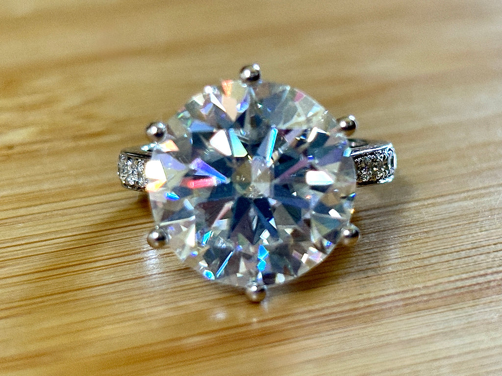 Moissanite ring. The 10ct certified 8H8A Moissanite “Tulip” statement ring with .50cttw Moissanite accents! Photos fail this GORGEOUS ring!