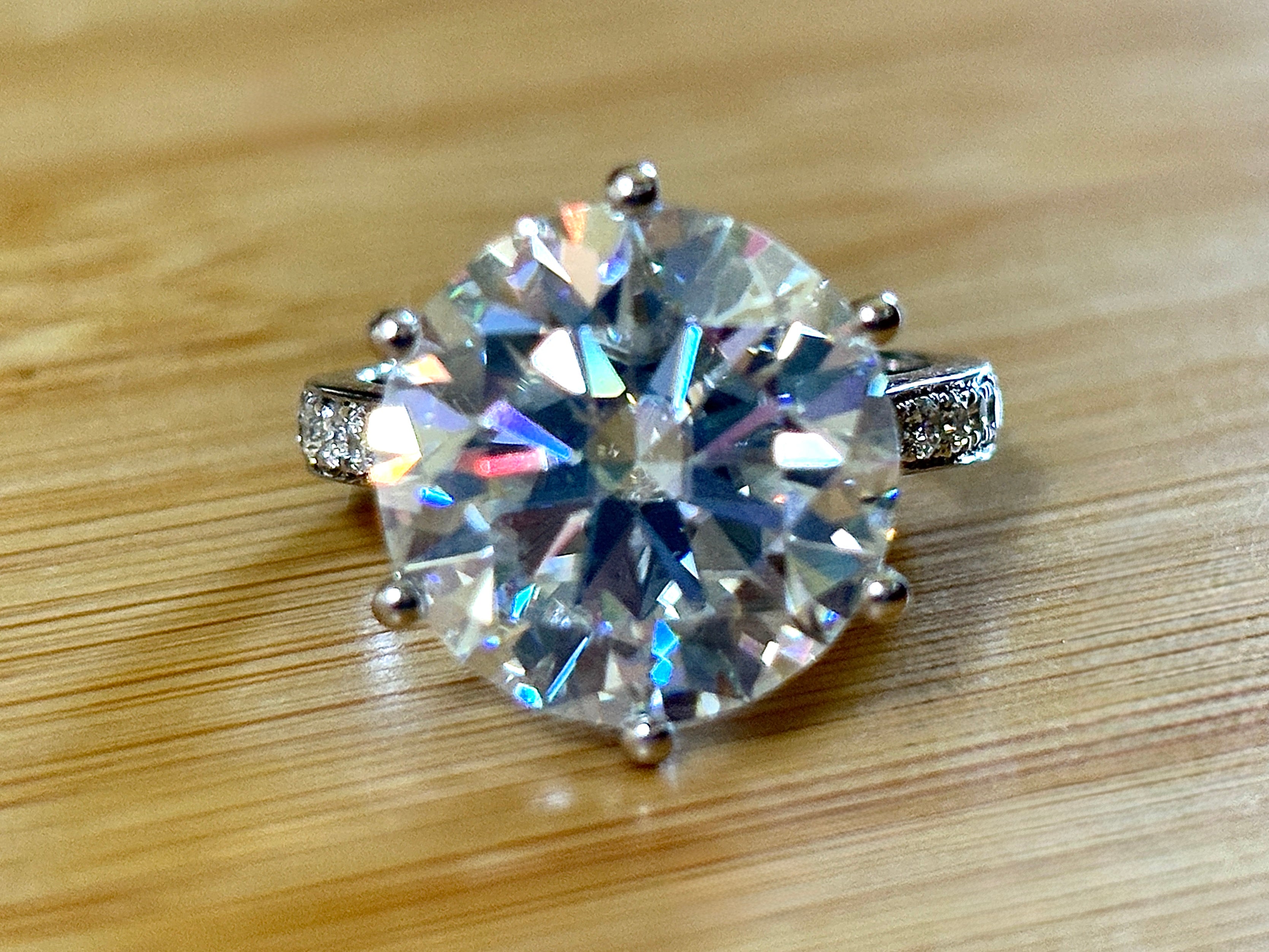 Moissanite ring. The 10ct certified 8H8A Moissanite “Tulip” statement ring with .50cttw Moissanite accents! Photos fail this GORGEOUS ring!