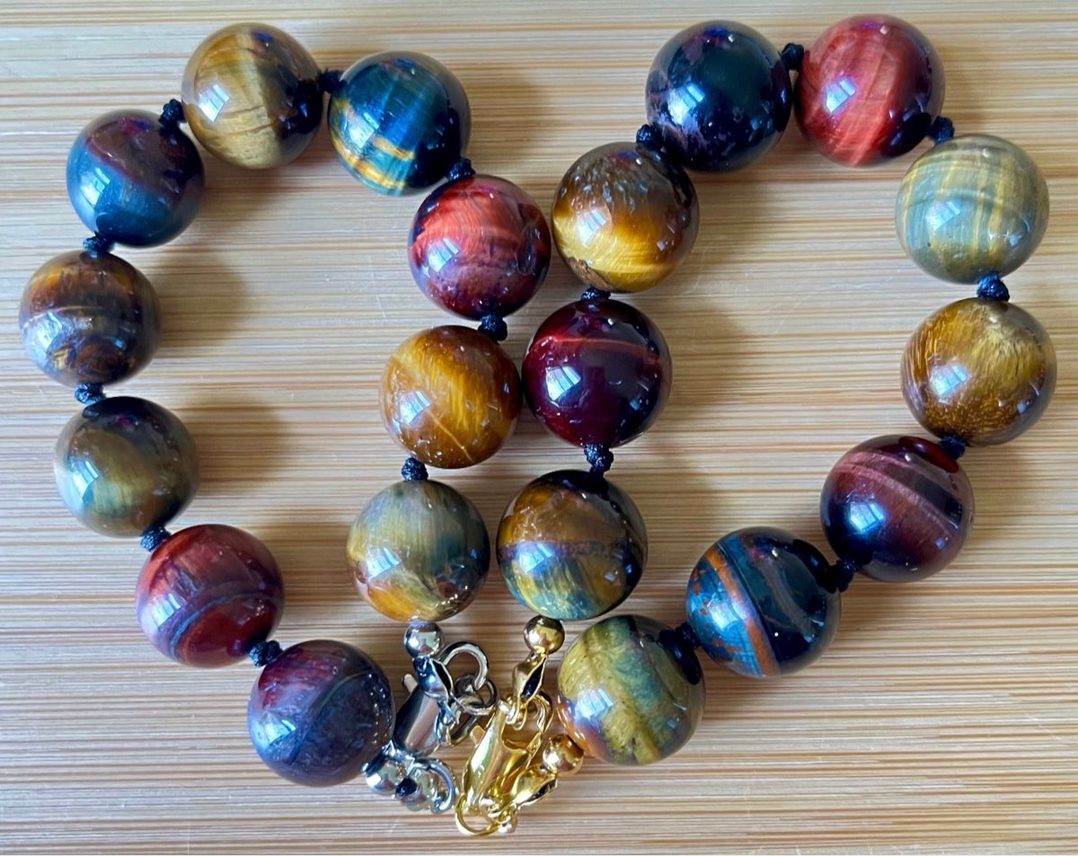 Tiger’s eye bracelet. 100% natural, highly chatoyant 14mm tricolored tiger’s eye hand knotted bracelet! Also available without the knots!