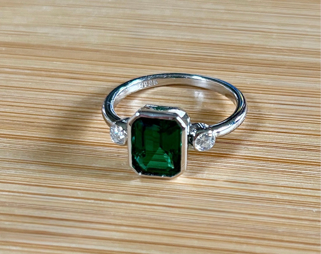 Emerald and Moissanite ring. A certified 2ct lab-grown emerald-cut Zambian emerald and .20cttw Moissanite ring! Exclusive to my shop!