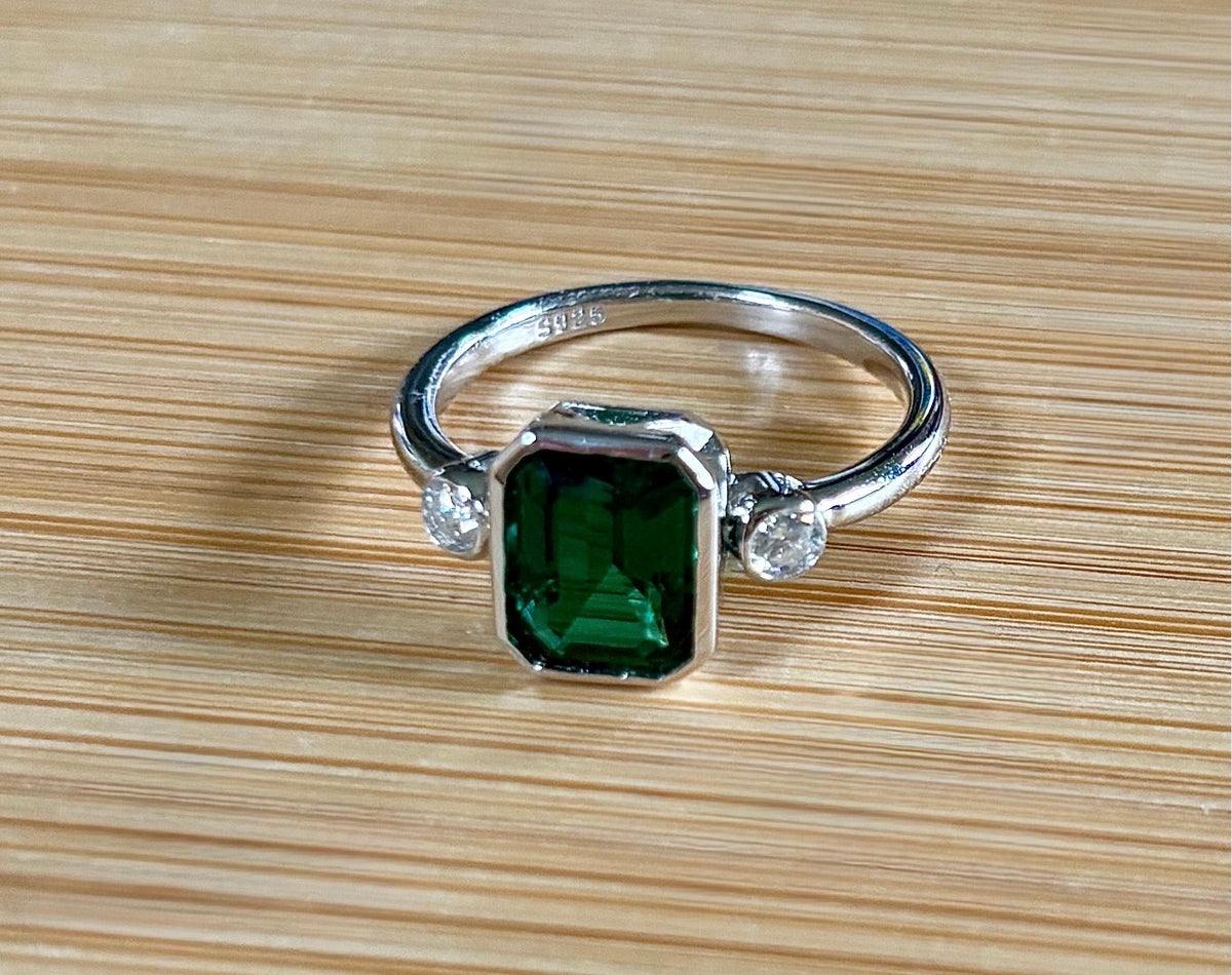 Emerald and Moissanite ring. A certified 2ct lab-grown emerald-cut Zambian emerald and .20cttw Moissanite ring! Exclusive to my shop!
