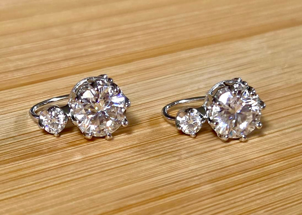 A Victorian inspired 4.2cttw certified pair of Moissanite 2-stone buckle back earrings in Argentium silver! Minimalist glam!