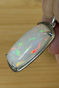 A 21ct AAA grade Ethiopian opal pendant, a handpicked opal and exclusive HKJ design! This lovely opal has gorgeous fire and play of color!