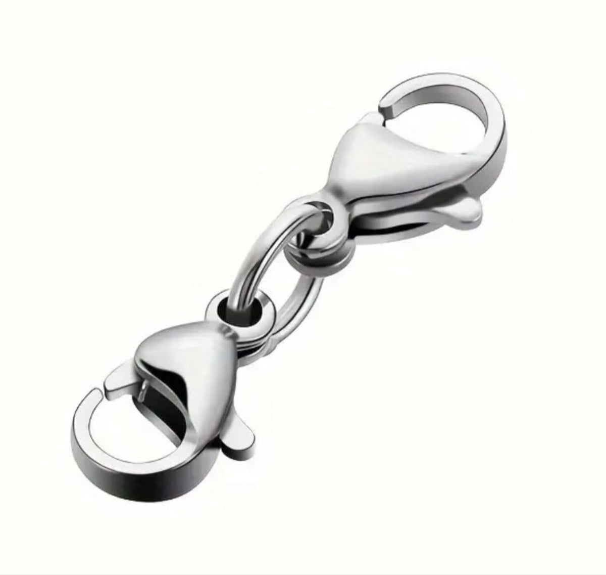 Small sterling silver cross charms, stainless steel double lobster clasps and stainless steel S-hooks for various jewelry applications.