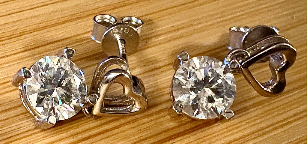 Moissanite earrings. Certified 2cttw round brilliant Moissanites dangling from heart-shaped posts are perfect for your Valentine (or you)!