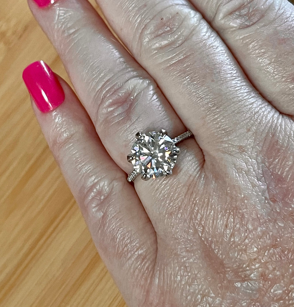 Moissanite ring. A certified 5ct Moissanite solitaire with zircon-accented shoulders, set in sterling silver and bathed in 18k!