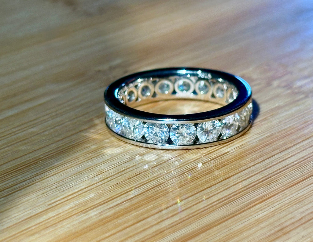 Moissanite ring. A 5.10cttw or 4.8cttw (depending on size) Moissanite eternity ring. A channel-set, classy and classic design - beautiful!