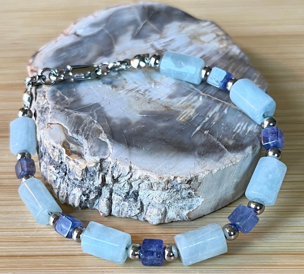 Aquamarine and tanzanite bracelet. The “True Blue” bracelet features trendy aquamarine barrels and dusky tanzanite cubes!