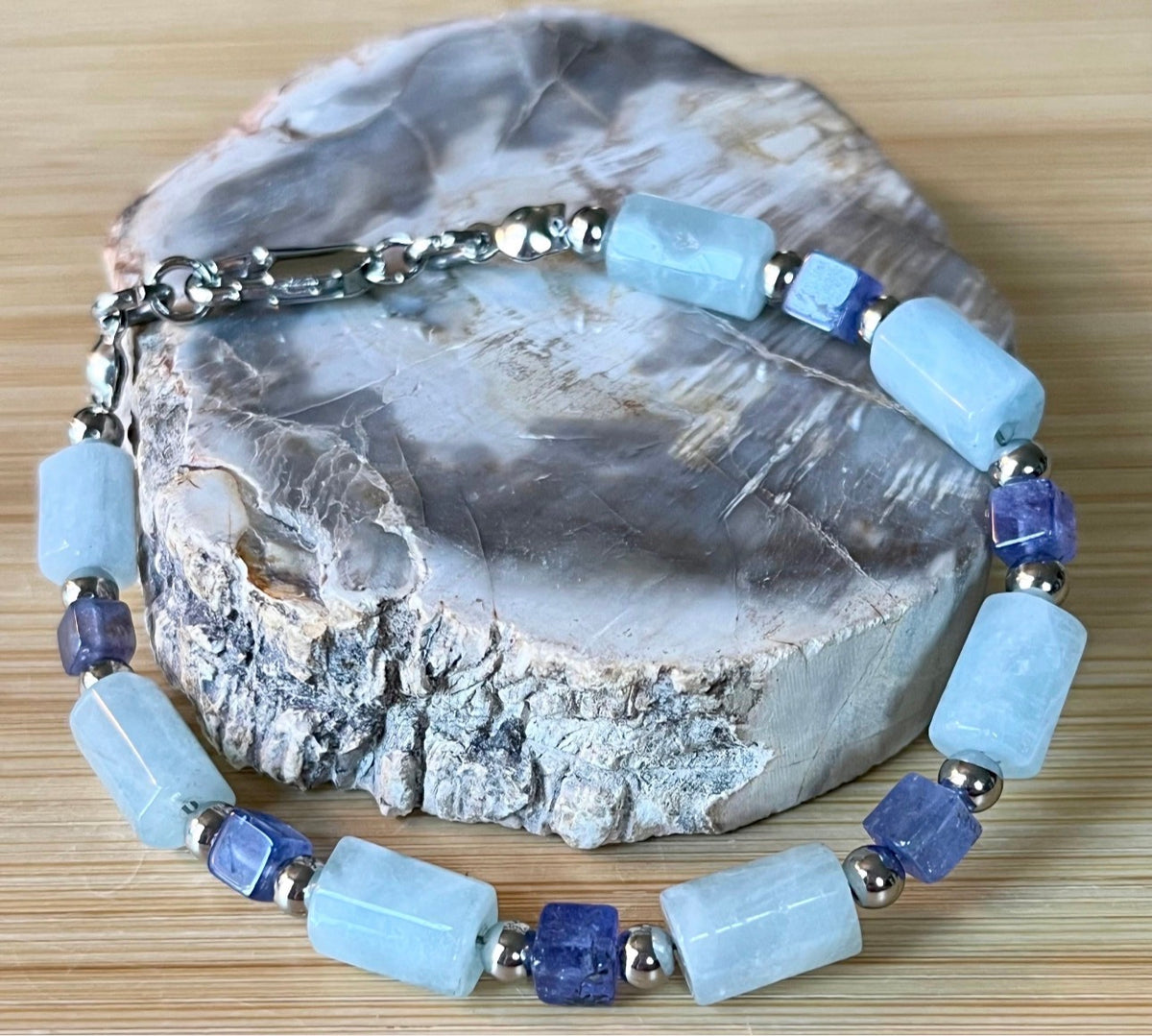 Aquamarine and tanzanite bracelet. The “True Blue” bracelet features trendy aquamarine barrels and dusky tanzanite cubes!