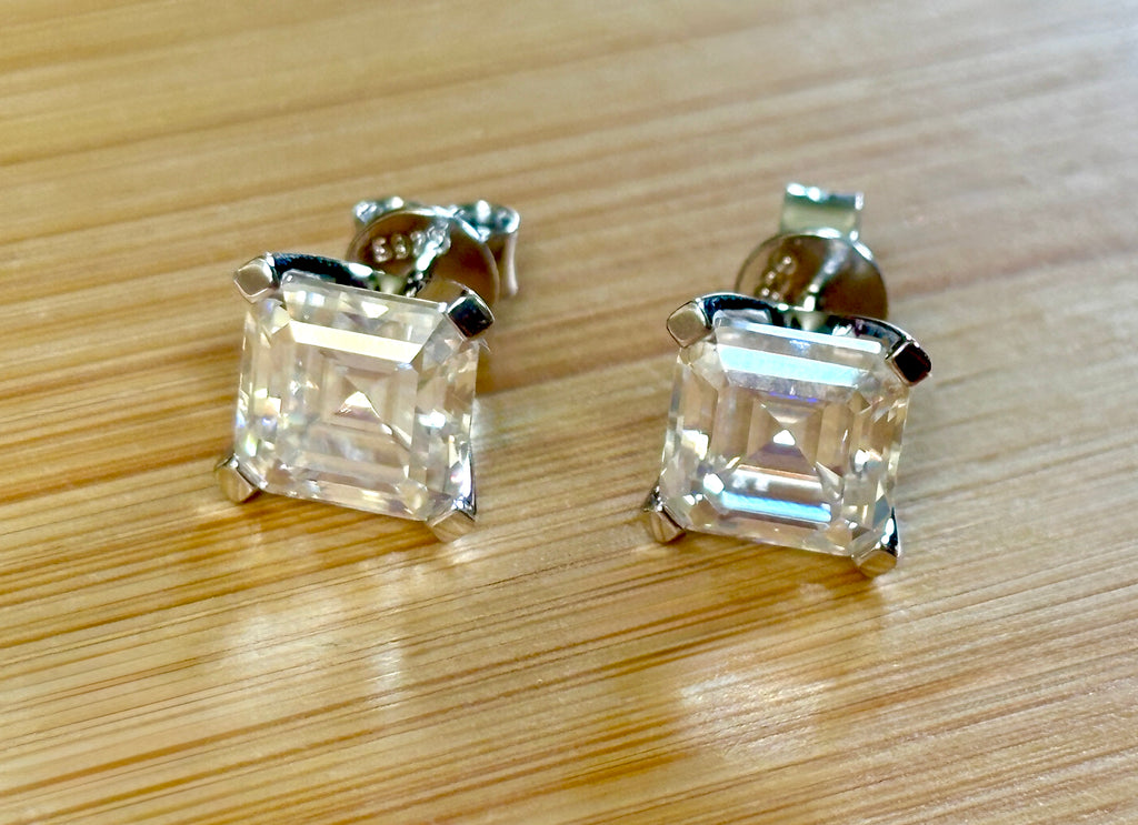 Moissanite studs. A 6.4ctw *perfect* pair of DOUBLE certified Asscher-cut Moissanites in my custom 4-claw 935 ARGENTIUM silver mountings! Opulent!