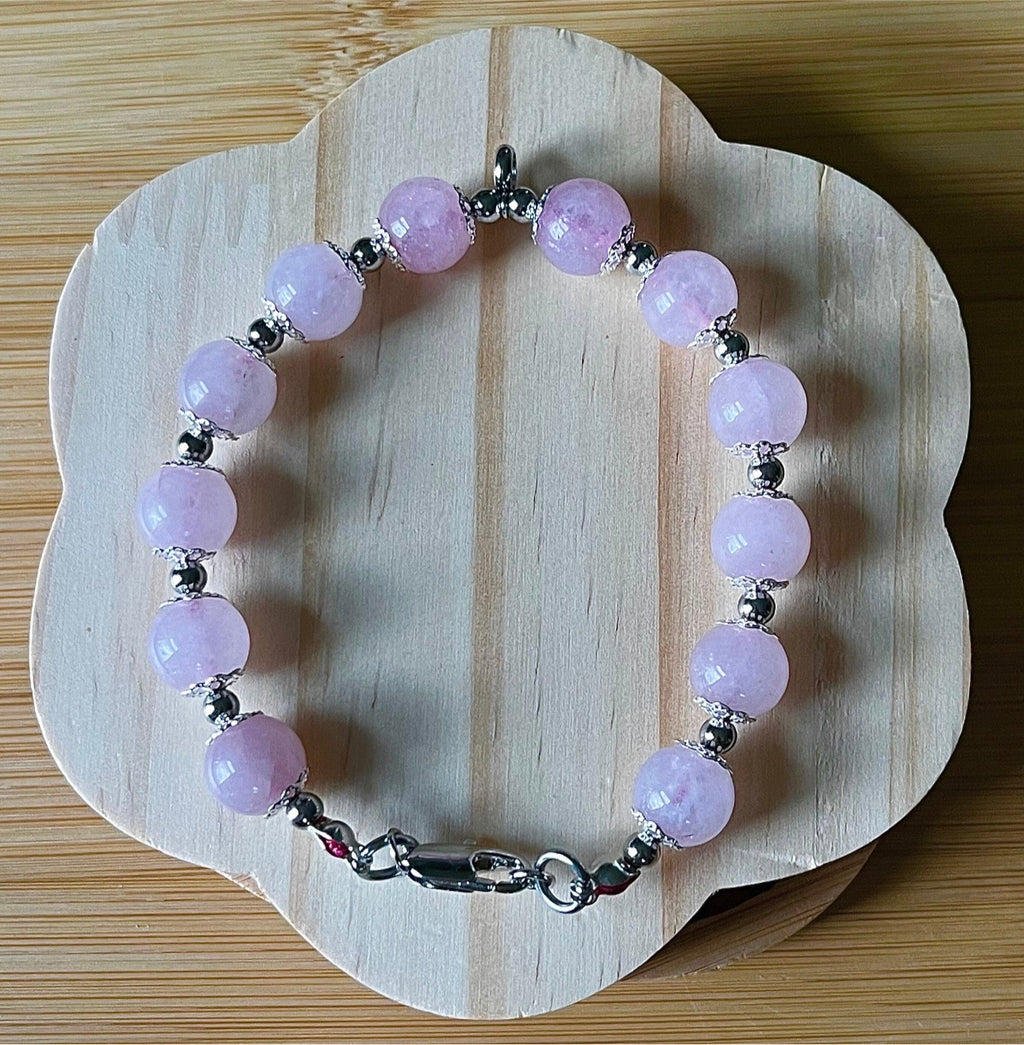 Rose quartz bracelet with 10mm Brazilian rose quartz beads and durable stainless steel components! The morganite pendant is optional.