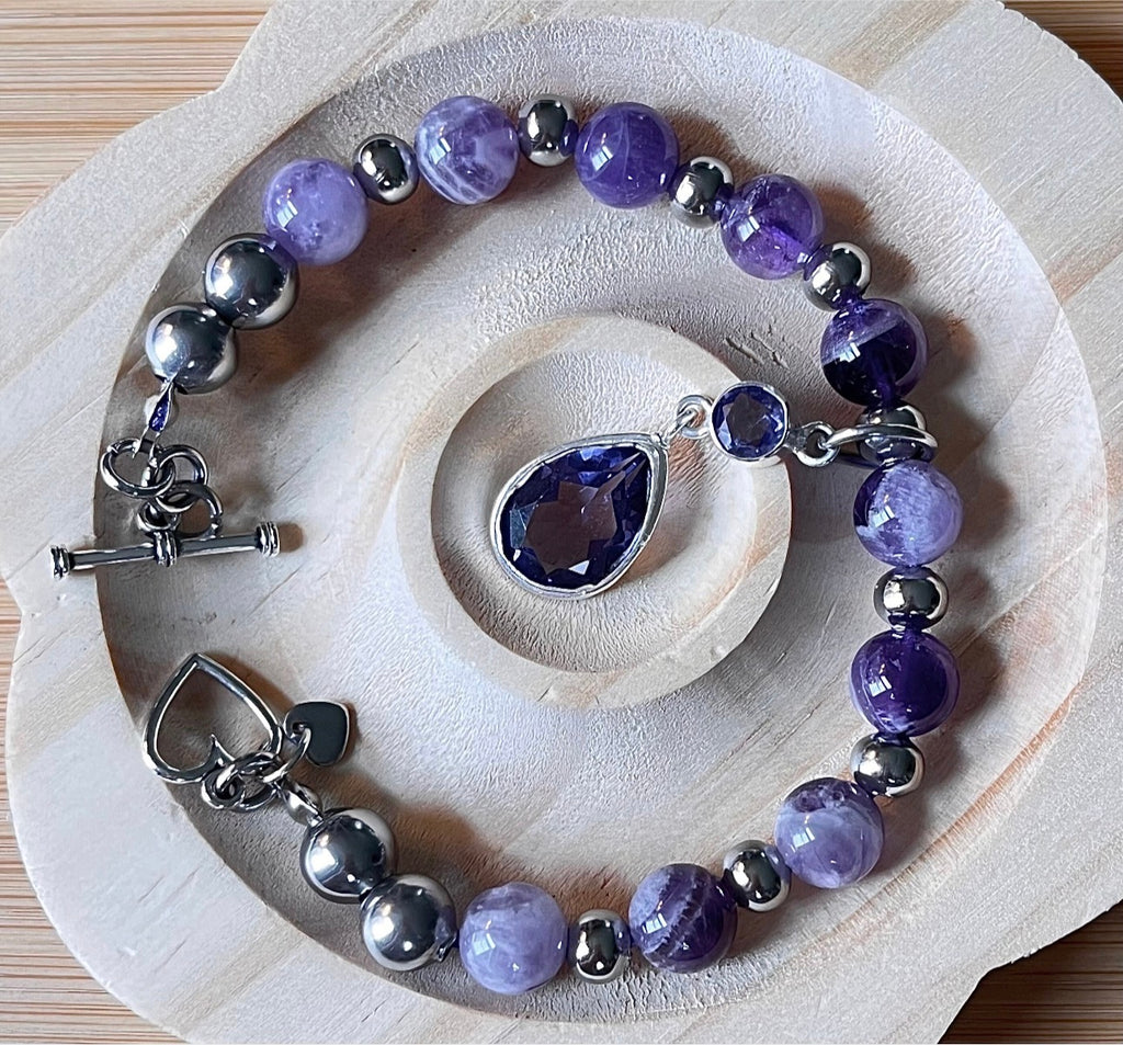 Amethyst bracelet. Pretty purple amethysts with chevron pattern crystallization! 8mm beads with durable stainless steel bracelet hardware!