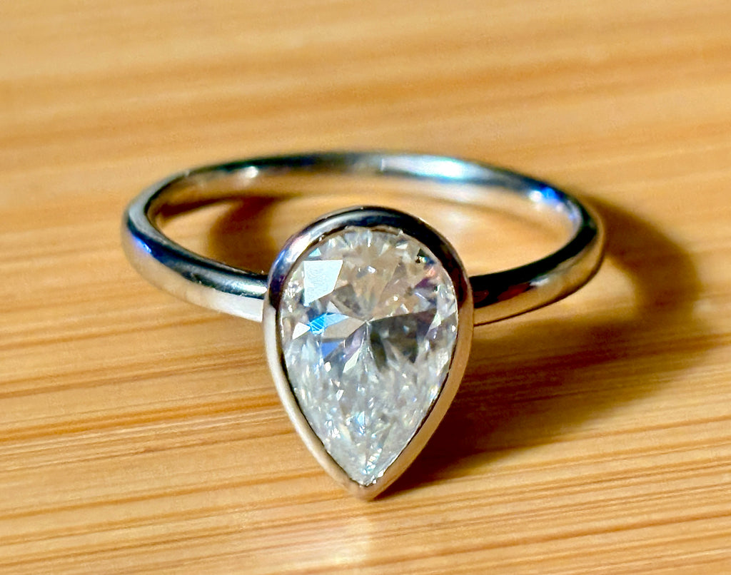 Moissanite ring. A certified 3ct pear in a hybrid basket + bezel of 925 sterling or 935 Argentium silver! A Hand Knotted Jewelry EXCLUSIVE!