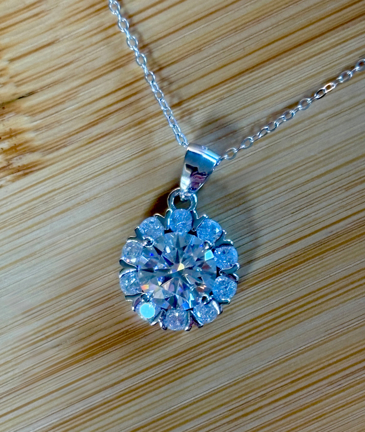 Moissanite necklace. A 3ct certified round brilliant Moissanite in a snowflake-shaped pendant ! A perfect piece for the holidays and beyond!