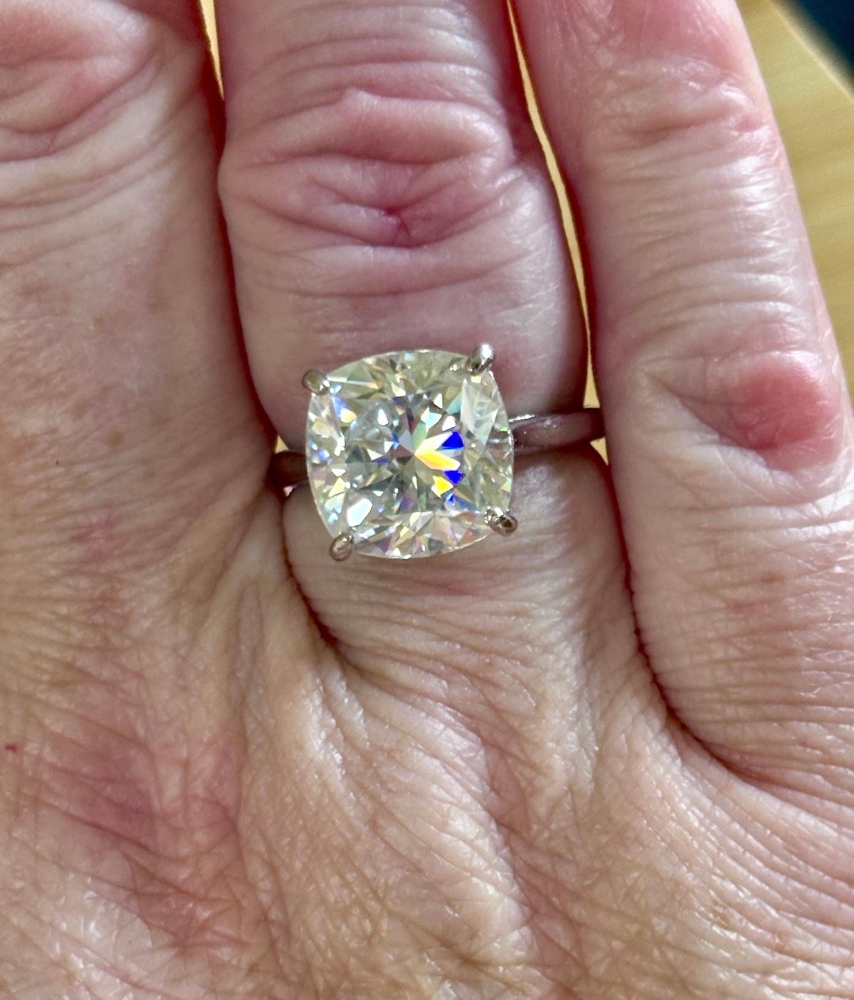 A fiery 9ct certified CLASSIC cushion-cut Moissanite solitaire, the ring of a certain princess (ex-princess?), but without the royal price tag! So indulge!