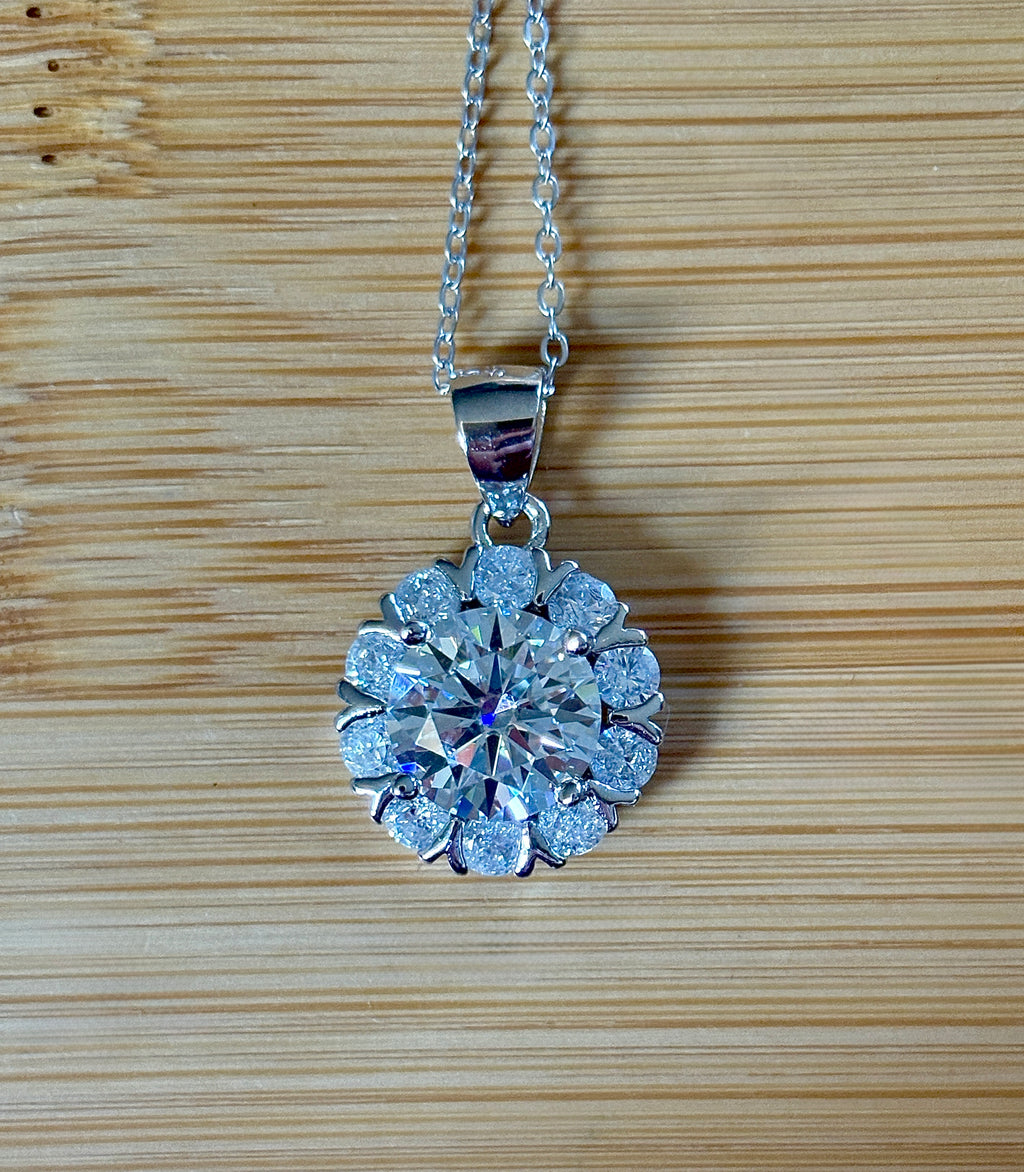 Moissanite necklace. A 3ct certified round brilliant Moissanite in a snowflake-shaped pendant ! A perfect piece for the holidays and beyond!