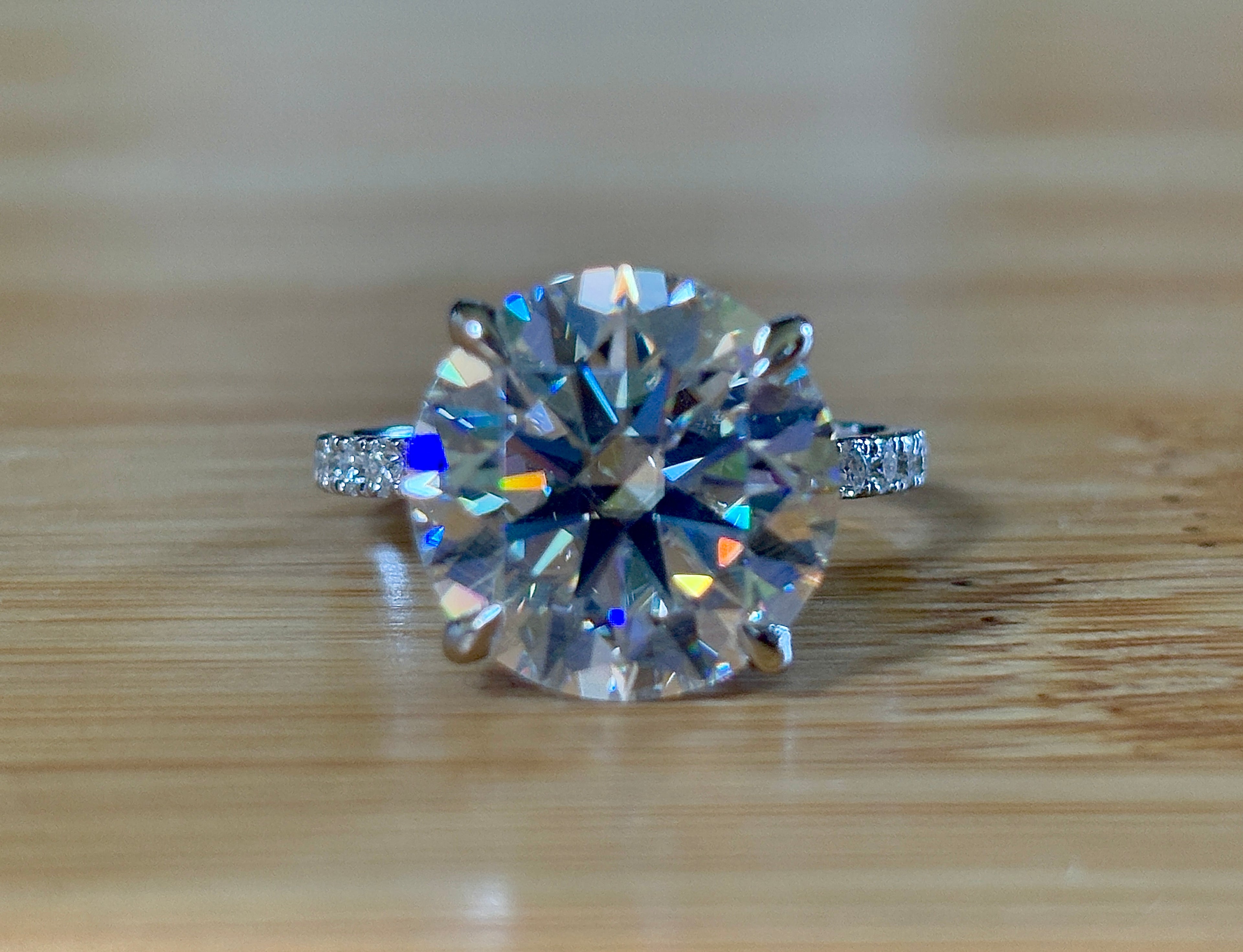 Moissanite solitaire. A glorious 10ct 8H8A Moissanite in a 4-prong mounting with a Moissanite “hidden halo” and shoulders, an 11.3cttw ring!