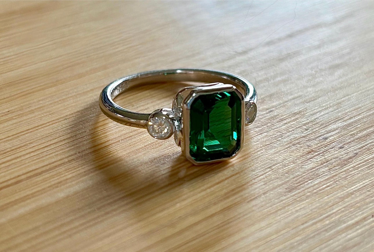 Emerald and Moissanite ring. A certified 2ct lab-grown emerald-cut Zambian emerald and .20cttw Moissanite ring! Exclusive to my shop!