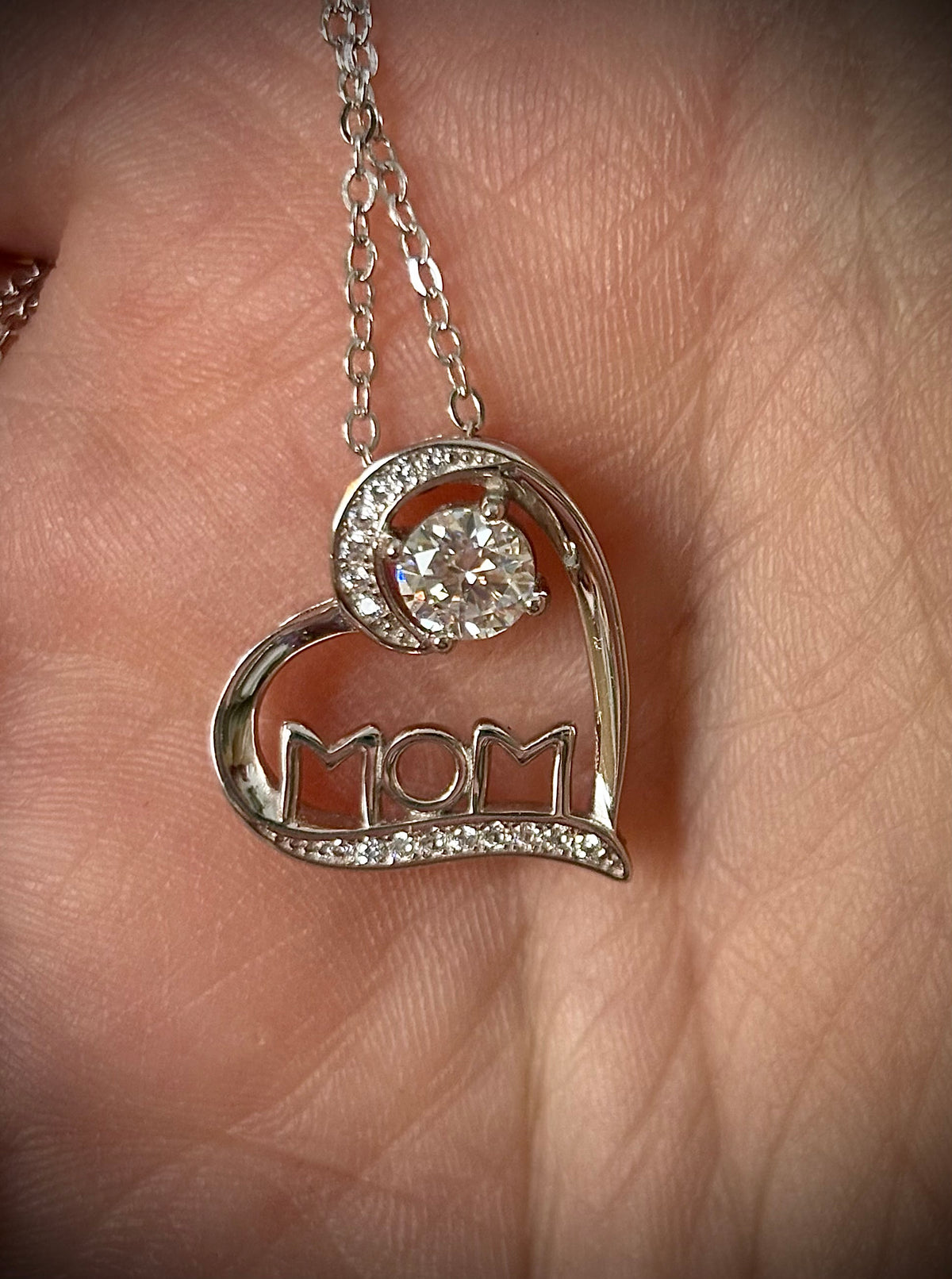 Moissanite necklace. A certified 1/2ct round radiant Moissanite in a pendant just for your mom or because you’re a mom, in sterling silver with zircon accents!