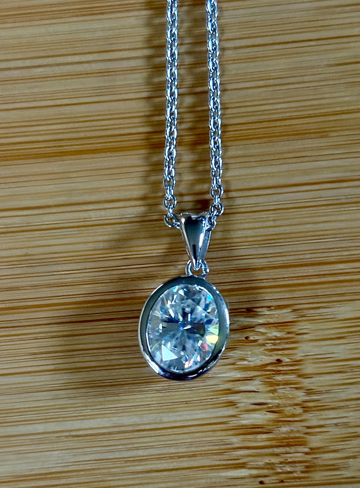 Moissanite solitaire necklace. A certified 5ct oval Moissanite in sterling silver and 18k!