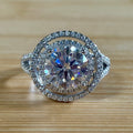 Moissanite ring. The 6.64cttw *fully* Moissanite “Bull’s Eye” ring, featuring a 4ct certified round brilliant Moissanite in a double halo!