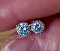 1cttw DOUBLE certified Moissanite studs with D-color and VVS1 clarity! Set in sterling silver bathed in 18k white gold, they’re a cut above!