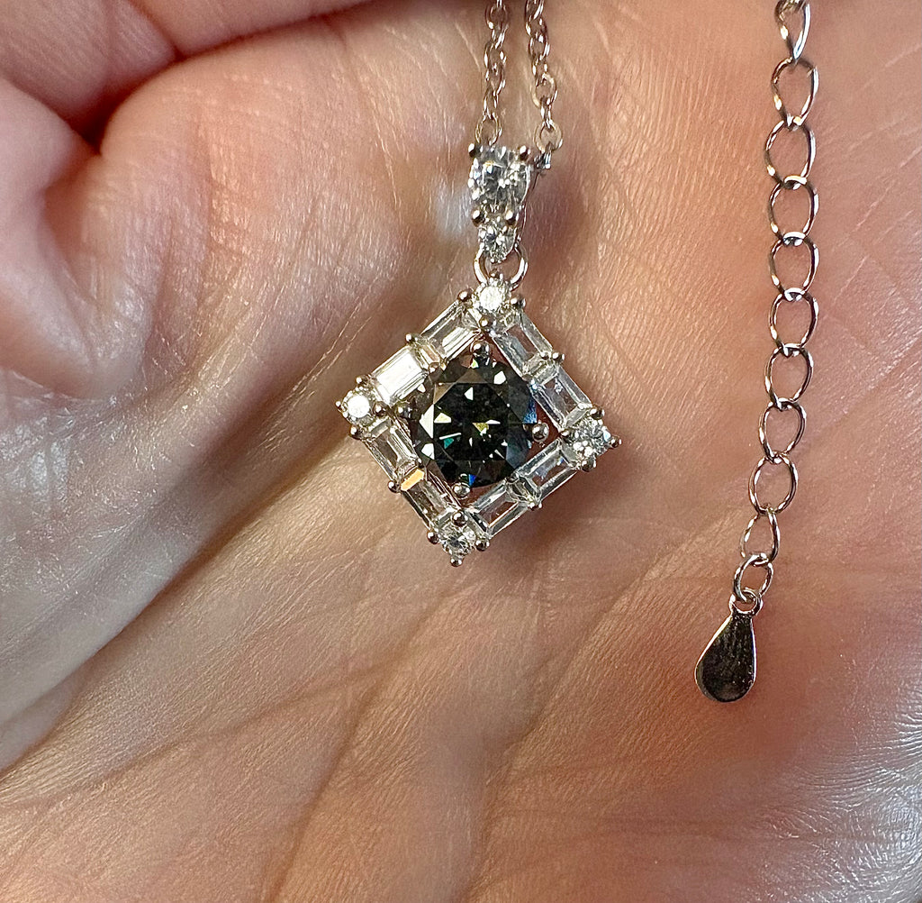 Moissanite necklace. A transfixingly gray 1ct certified round brilliant Moissanite centered in a halo of white zircons - a 2.25cttw pendant!