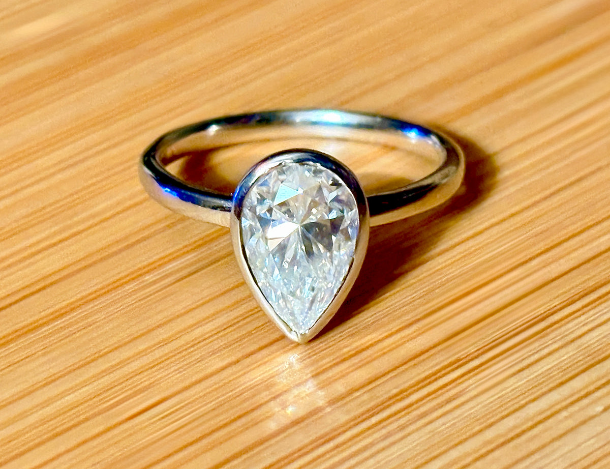 Moissanite ring. A certified 3ct pear in a hybrid basket + bezel of 925 sterling or 935 Argentium silver! A Hand Knotted Jewelry EXCLUSIVE!