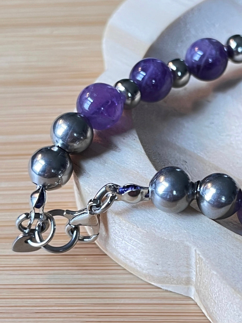 Amethyst bracelet. Pretty purple amethysts with chevron pattern crystallization! 8mm beads with durable stainless steel bracelet hardware!