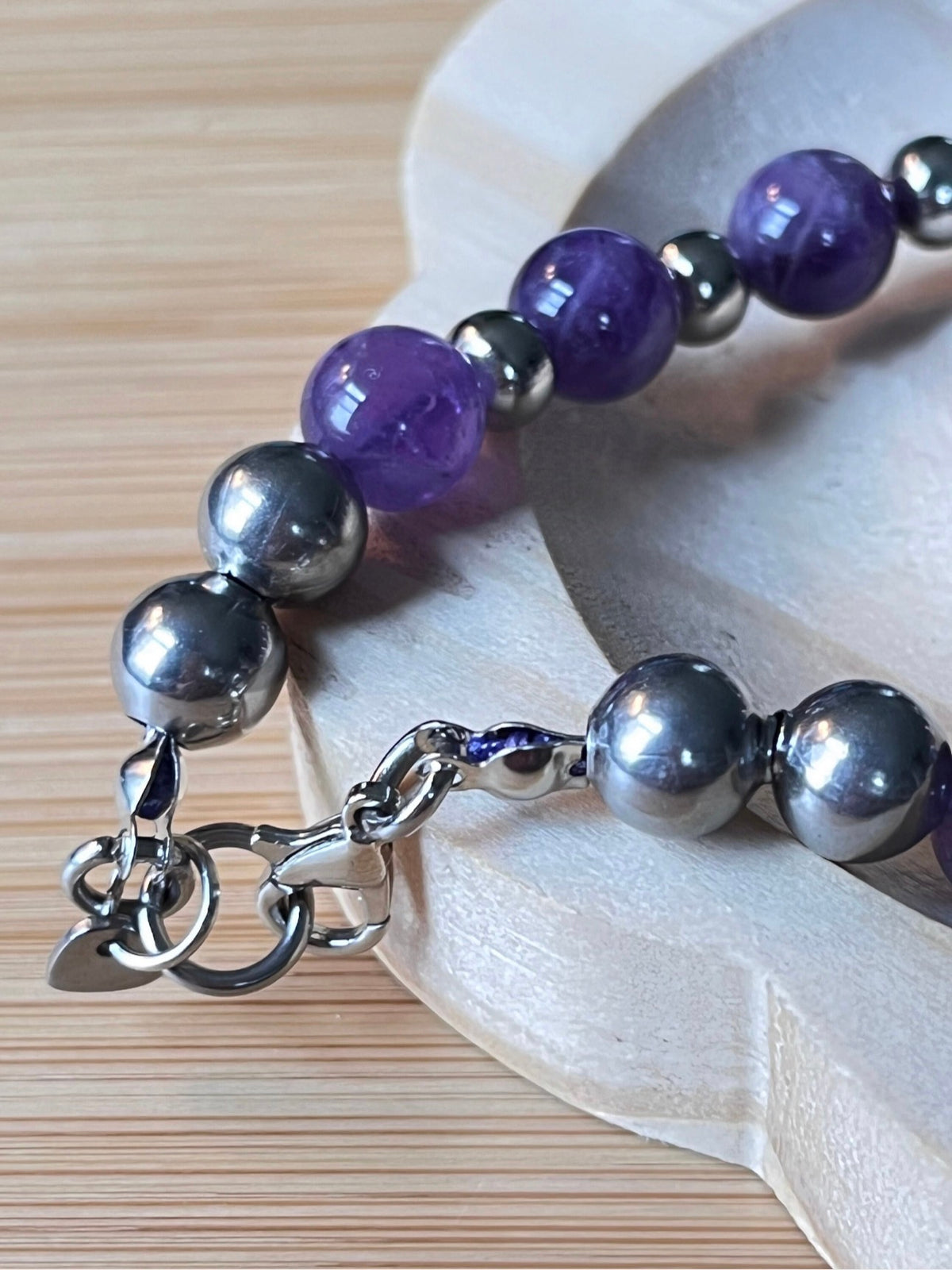 Amethyst bracelet. Pretty purple amethysts with chevron pattern crystallization! 8mm beads with durable stainless steel bracelet hardware!