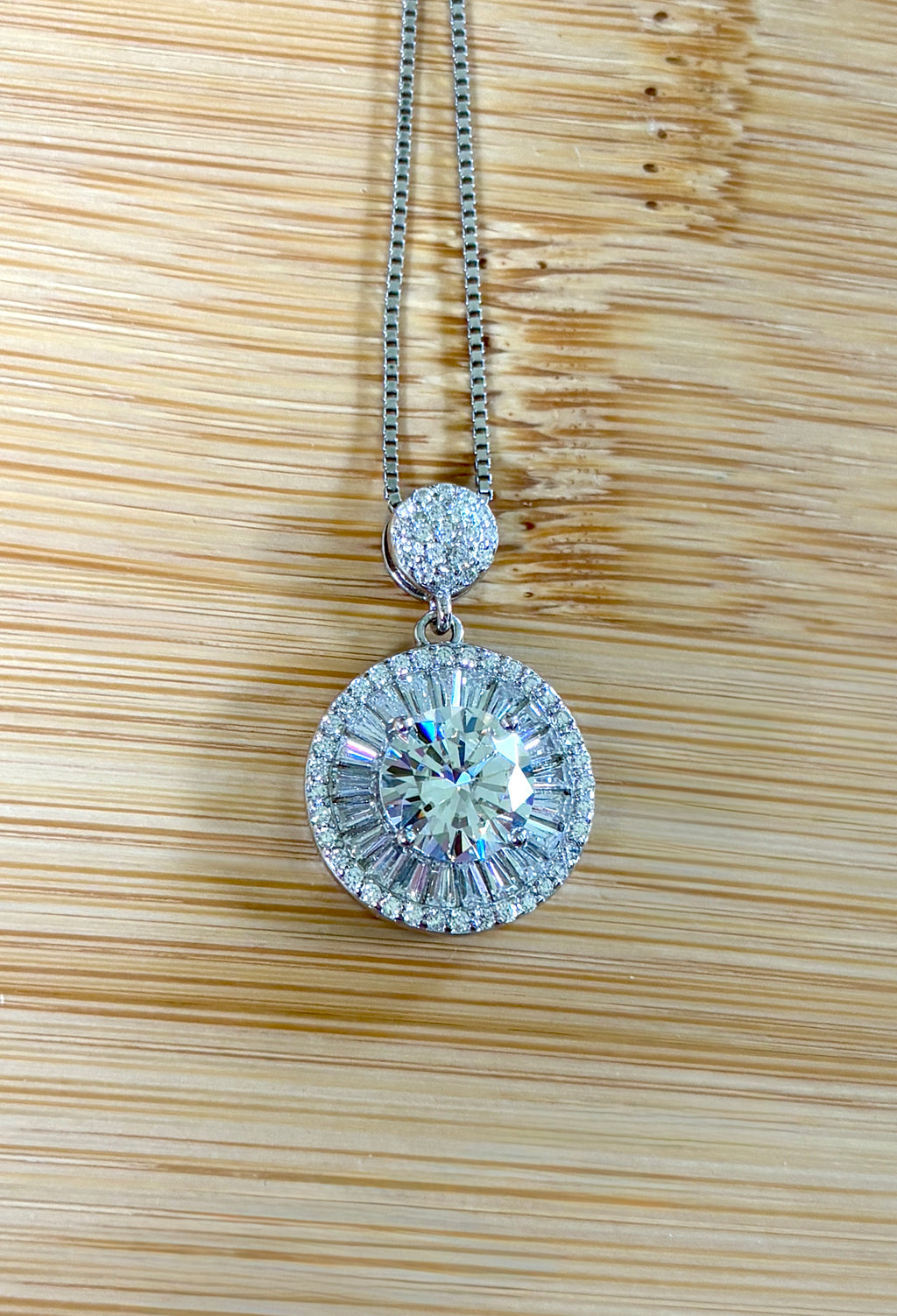 Moissanite necklace. The certified 2ct Moissanite “Sunburst” necklace with a 61 gemstone pendant plus more in the bail! Radiantly beautiful!