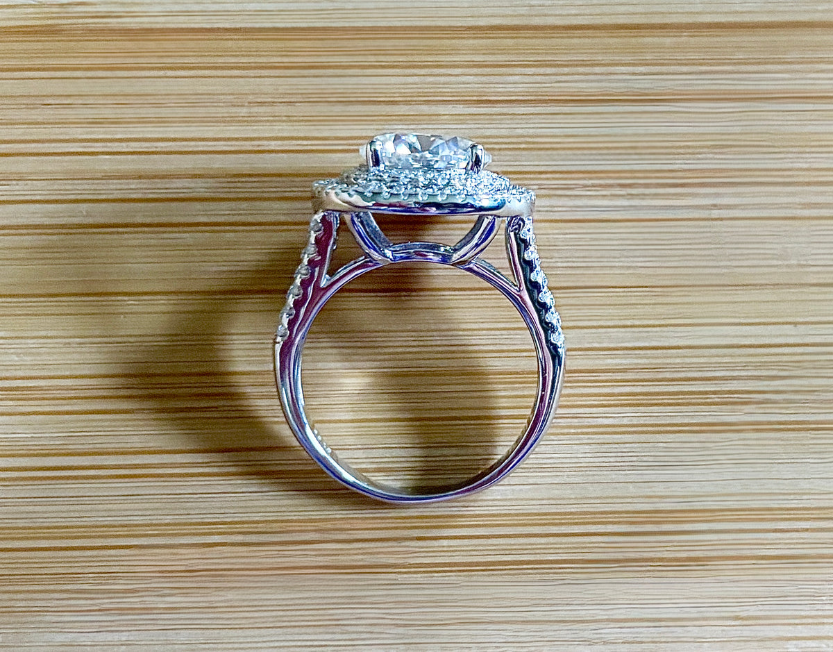 Moissanite ring. The 6.64cttw *fully* Moissanite “Bull’s Eye” ring, featuring a 4ct certified round brilliant Moissanite in a double halo!