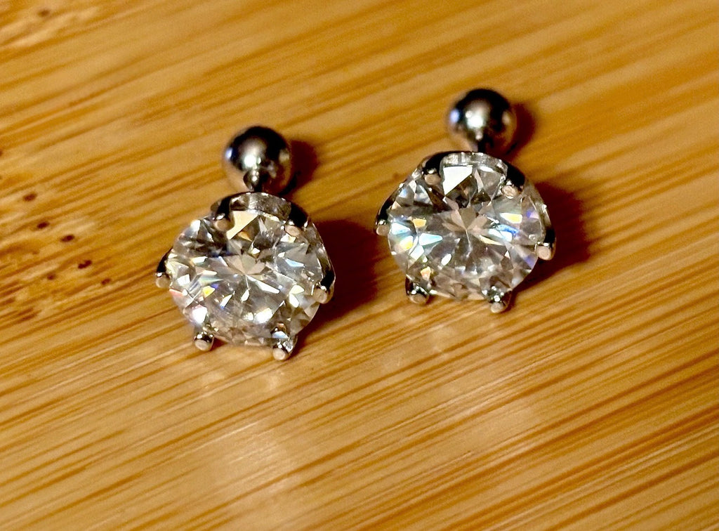 A certified pair of pretty, floral-inspired 2cttw or 4cttw Moissanite studs in poinsettia-shaped settings w/screwball backs OR 4cttw w/push backs!