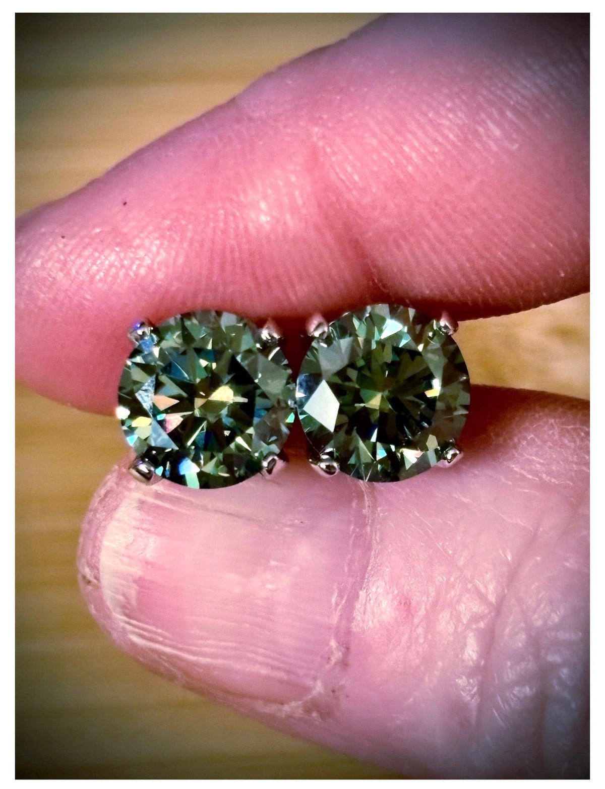 Moissanite studs. A 2cttw or 6cttw pair of cyan (greenish-blue) Moissanite studs. Double certified and rich in color, they are delicious!
