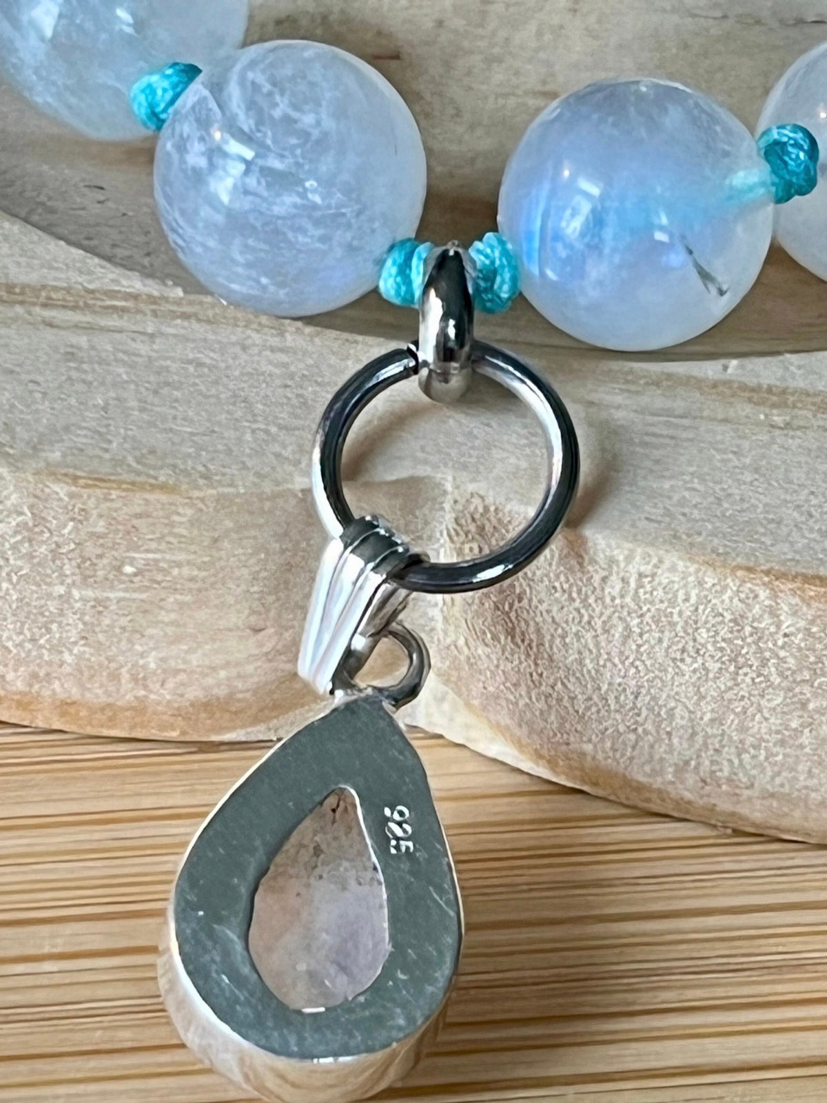 Rainbow moonstone bracelet, hand knotted with high quality 9-10mm beads! The solid sterling silver moonstone pendant is *optional*.