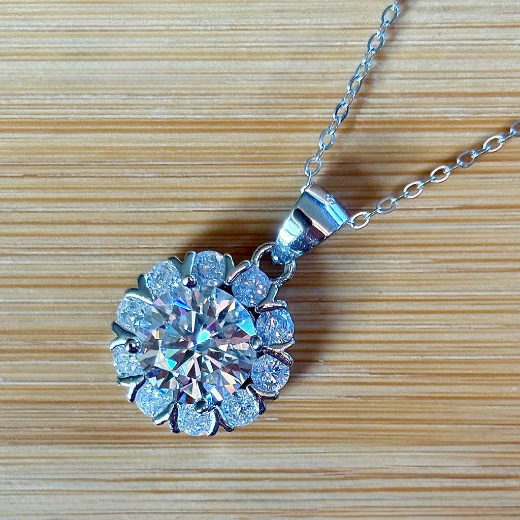 Moissanite necklace. A 3ct certified round brilliant Moissanite in a snowflake-shaped pendant ! A perfect piece for the holidays and beyond!