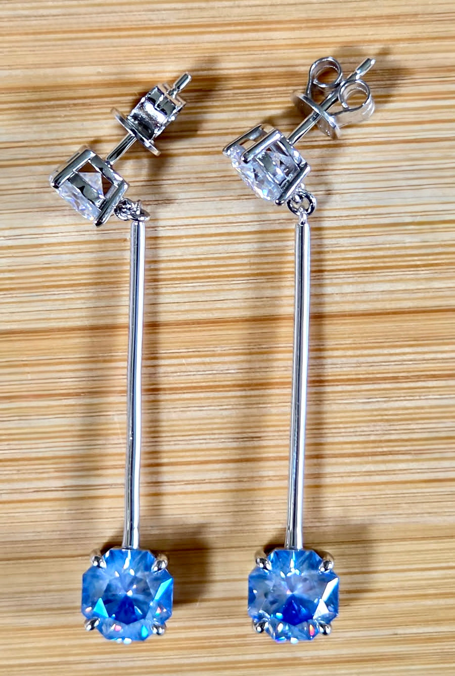 8ctw Moissanite pendulum earrings, with 3ct octagonal frosty aquamarine Moissanites at the bottom of the pendulum, and 1ct white round brilliant Moissanites at the top! Full Argentium silver construction with sterling silver disk backs! An HKJ exclusive!