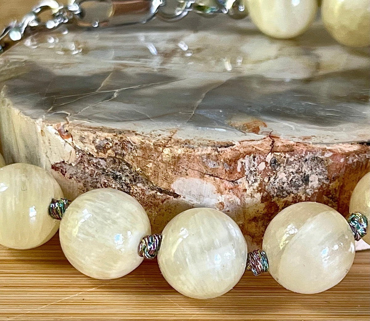 Silky yellow quartz bracelet. Chatoyant 10mm buttercream quartzite (AKA silk jade) hand-knotted bracelet with METALLIC string!