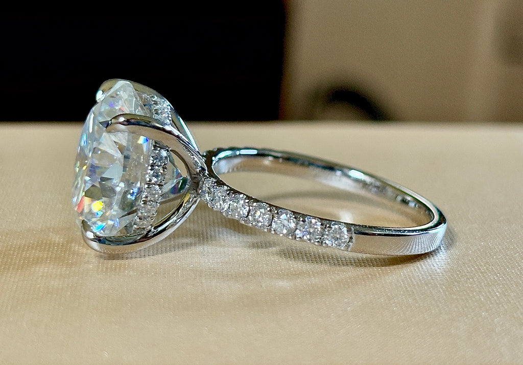Moissanite solitaire. A glorious 10ct 8H8A Moissanite in a 4-prong mounting with a Moissanite “hidden halo” and shoulders, an 11.3cttw ring!