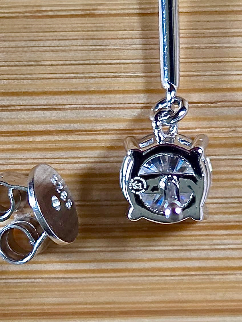 8ctw Moissanite pendulum earrings, with 3ct octagonal frosty aquamarine Moissanites at the bottom of the pendulum, and 1ct white round brilliant Moissanites at the top! Full Argentium silver construction with sterling silver disk backs! An HKJ exclusive!