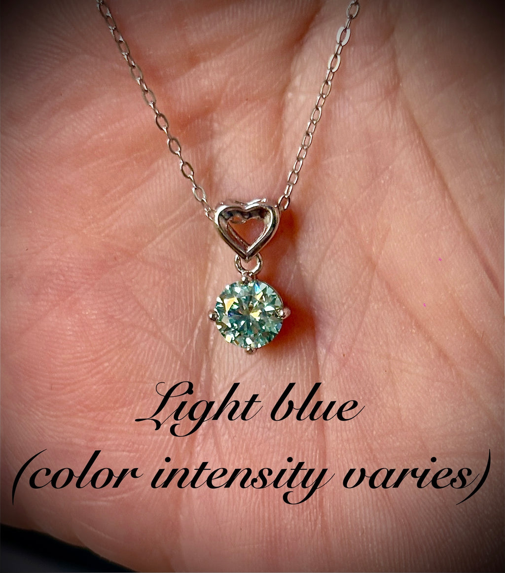 Moissanite necklace. A romantic heart-shaped pendant featuring a certified 1ct round WHITE or BLUE round brilliant Moissanite in sterling silver!