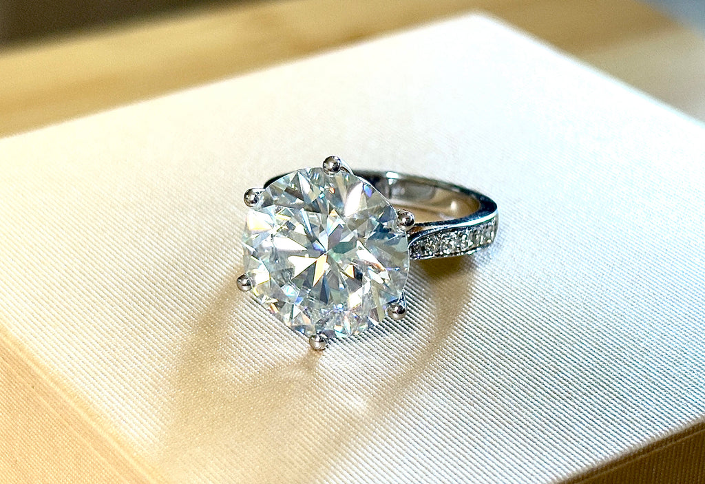 Moissanite ring. The 10ct certified 8H8A Moissanite “Tulip” statement ring with .50cttw Moissanite accents! Photos fail this GORGEOUS ring!