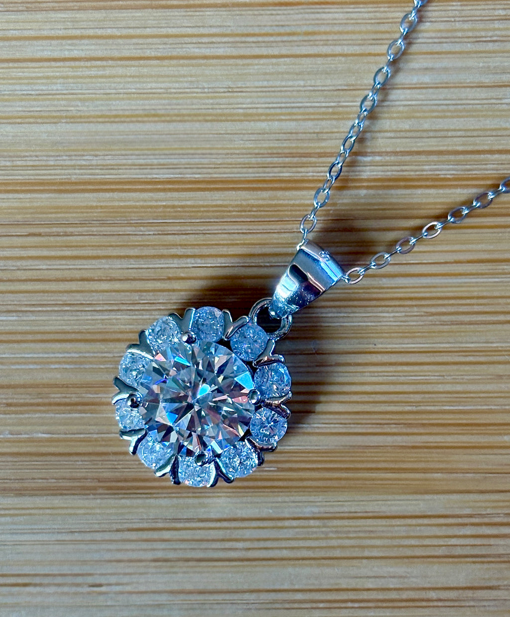 Moissanite necklace. A 3ct certified round brilliant Moissanite in a snowflake-shaped pendant ! A perfect piece for the holidays and beyond!